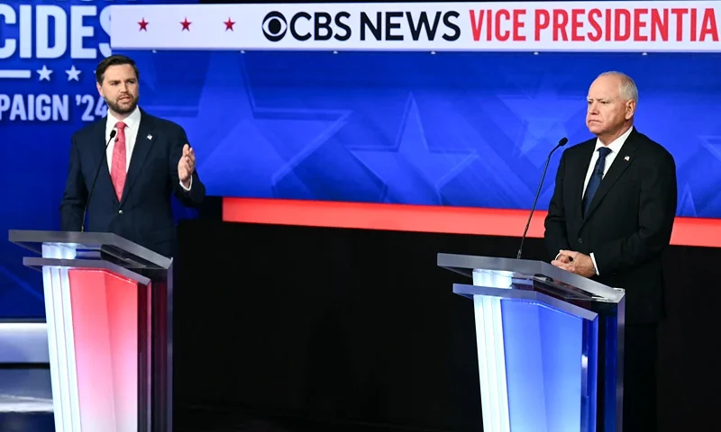 US Senator and Republican vice presidential candidate J.D. Vance (L) and Minnesota Governor and Democratic vice presidential candidate Tim Walz participate in the Vice Presidential debate hosted by CBS News at the CBS Broadcast Center in New York City on October 1, 2024. (Photo by ANGELA WEISS / AFP) (Photo by ANGELA WEISS/AFP via Getty Images)