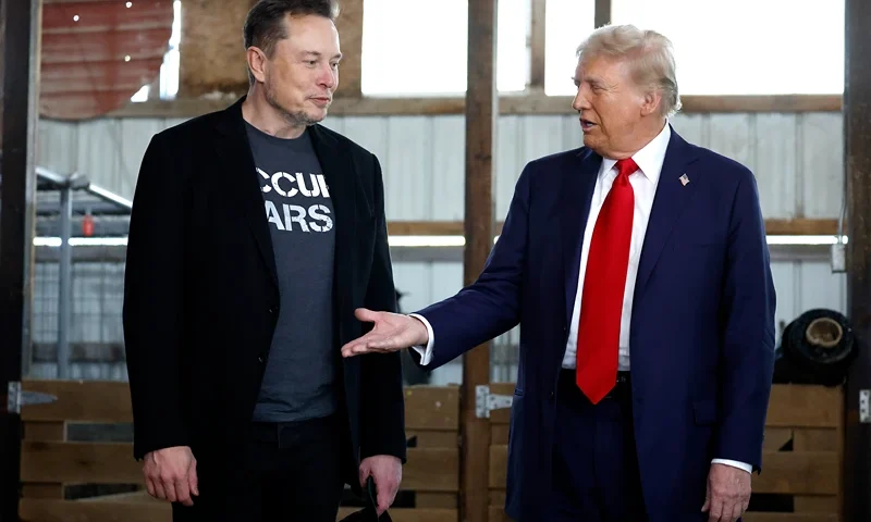 BUTLER, PENNSYLVANIA - OCTOBER 05: Republican presidential nominee, former President Donald Trump offers his hand to Elon Musk back stage during a campaign rally at the Butler Farm Show grounds on October 05, 2024 in Butler, Pennsylvania. This is the first time that Trump has returned to Butler since he was injured during an attempted assassination on July 13. (Photo by Anna Moneymaker/Getty Images)