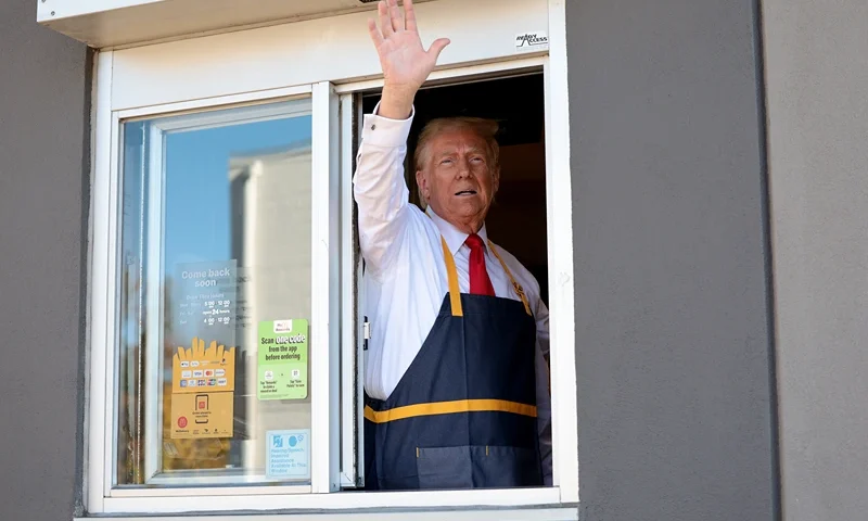 Republican presidential nominee, former U.S. President Donald Trump works the drive-through line as he visits a McDonald's restaurant on October 20, 2024 in Feasterville-Trevose, Pennsylvania. Trump is campaigning the entire day in the state of Pennsylvania. Trump and Democratic presidential nominee Vice President Kamala Harris continue to campaign in battleground swing states ahead of the November 5th election. (Photo by Win McNamee/Getty Images)