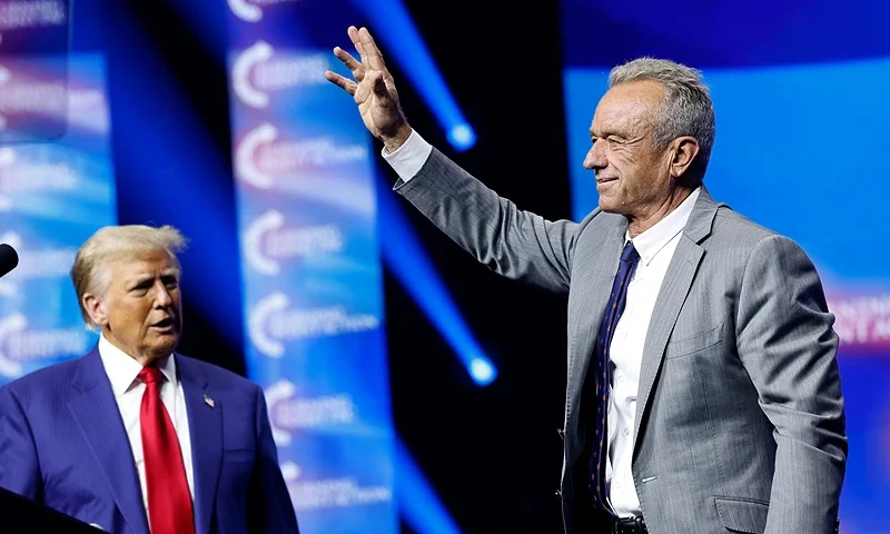 DULUTH, GEORGIA - OCTOBER 23: Republican presidential nominee, former U.S. President Donald Trump welcomes Robert F. Kennedy Jr. to the stage at a Turning Point Action campaign rally at the Gas South Arena on October 23, 2024 in Duluth, Georgia. Trump is campaigning across Georgia today as he and Democratic presidential nominee, U.S. Vice President Kamala Harris attempt to win over swing state voters. (Photo by Anna Moneymaker/Getty Images)