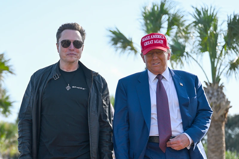 U.S. President-elect Donald Trump greets Elon Musk as he arrives to attend a viewing of the launch of the sixth test flight of the SpaceX Starship rocket on November 19, 2024 in Brownsville, Texas. SpaceX’s billionaire owner, Elon Musk, a Trump confidante, has been tapped to lead the new Department of Government Efficiency alongside former presidential candidate Vivek Ramaswamy. (Photo by Brandon Bell/Getty Images)