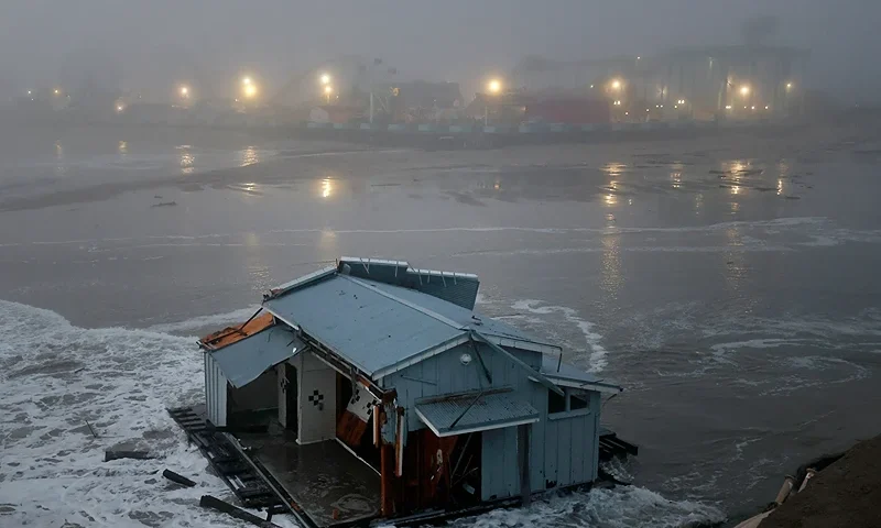 The collapsed pier at the Santa Cruz Wharf is pictured in Santa Cruz, California, on December 23, 2024. A pier collapsed into the ocean and floated away off the US state of California on Monday, weather authorities said, as the region was pounded by a powerful storm. Lifeguards rescued two people after the structure in Santa Cruz broke free, firefighters said, while a third person managed to get themselves out of trouble. (Photo by Daniel Dreifuss / AFP) (Photo by DANIEL DREIFUSS/AFP via Getty Images)