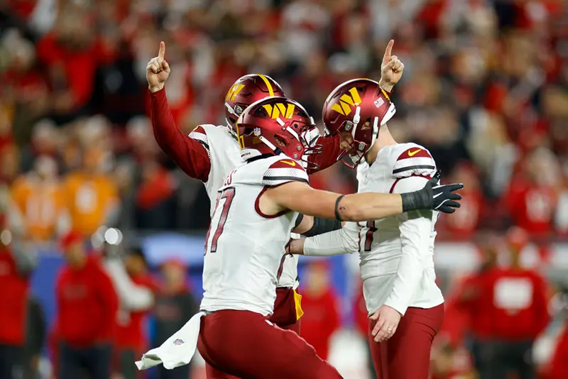 Zane Gonzalez #47 of the Washington Commanders celebrates with his teammates after making a 37 yard game winning field goal against the Tampa Bay Buccaneers to win the NFC Wild Card Playoff at Raymond James Stadium on January 12, 2025 in Tampa, Florida. (Photo by Mike Ehrmann/Getty Images)