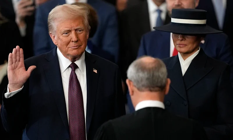 Donald Trump is sworn in as the 47th president of the United States by Chief Justice John Roberts as Melania Trump holds the Bible in the US Capitol Rotunda in Washington, DC, on January 20, 2025. Donald Trump is sworn in as the 47th president of the United States by Chief Justice John Roberts as Melania Trump holds the Bible (Photo by Julia Demaree Nikhinson / AFP) (Photo by JULIA DEMAREE NIKHINSON/AFP via Getty Images)
