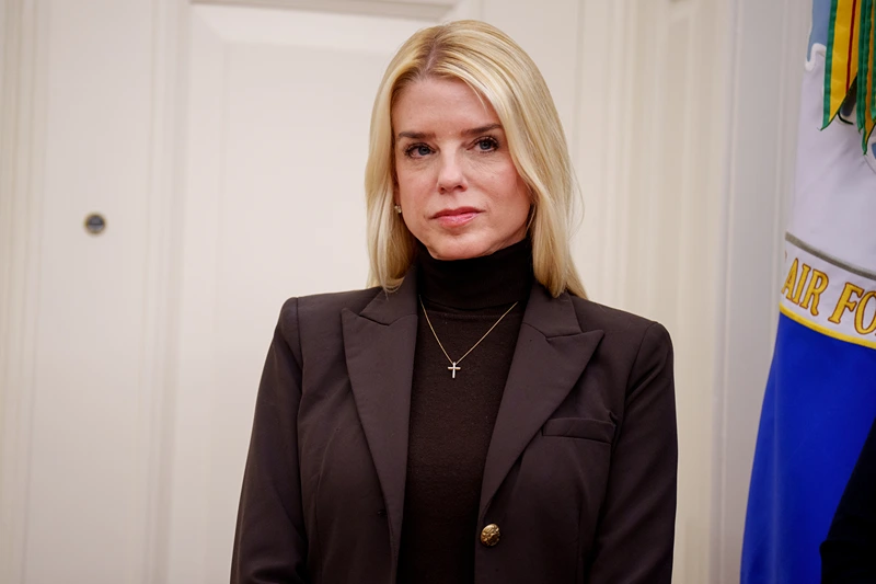 WASHINGTON, DC - FEBRUARY 12: Attorney General Pam Bondi listens as U.S. President Donald Trump speaks after Tulsi Gabbard is sworn in as Director of National Intelligence in the Oval Office at the White House on February 12, 2025 in Washington, DC. Gabbard, who will oversee the 18 intelligence agencies and serve as Trump's advisory on intelligence, was confirmed by the Senate 52-48. (Photo by Andrew Harnik/Getty Images)