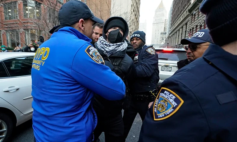 NYPD police arrest a protester during a rally demanding the abolition of the US Immigration and Customs Enforcement (ICE) and the immigration policies of President Donald Trump, in New York on February 13, 2025. (Photo by TIMOTHY A. CLARY / AFP) (Photo by TIMOTHY A. CLARY/AFP via Getty Images)