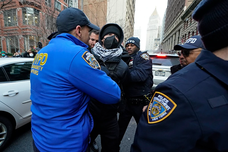NYPD police arrest a protester during a rally demanding the abolition of the US Immigration and Customs Enforcement (ICE) and the immigration policies of President Donald Trump, in New York on February 13, 2025. (Photo by TIMOTHY A. CLARY / AFP) (Photo by TIMOTHY A. CLARY/AFP via Getty Images)