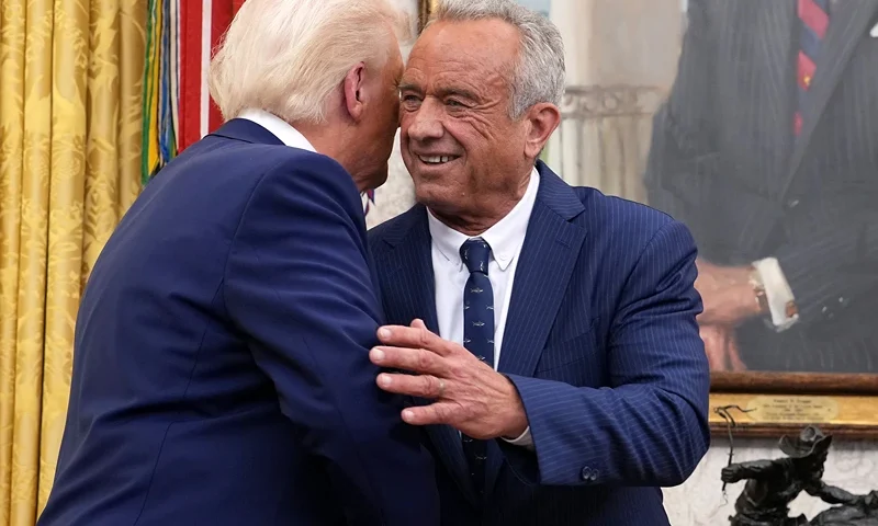 WASHINGTON, DC - FEBRUARY 13: U.S. President Donald Trump embraces Robert F. Kennedy Jr. after Kennedy was sworn in as Secretary of Health and Human Services in the Oval Office at the White House on February 13, 2025 in Washington, DC. Kennedy, who faced criticism for his past comments on vaccine, was confirmed by the Senate 52 to 48. Former Senate Republican Leader Mitch McConnell (R-KY) was the only Republican to vote against him. (Photo by Andrew Harnik/Getty Images)