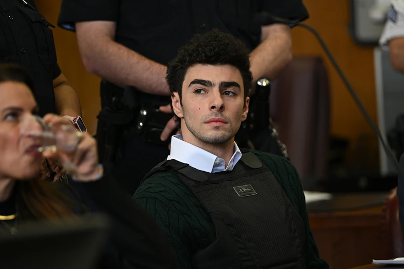 NEW YORK, NEW YORK - FEBRUARY 21: Luigi Mangione appears at a hearing for the murder of UHC CEO Brian Thompson at Manhattan Criminal Court on February 21, 2025 in New York City. Mangione is accused of slaying of UnitedHealthcare CEO Brian Thompson late last year and is making his first appearance on state charges of murder as an act of terrorism. He is facing 11 counts for the Dec. 4 shooting of Thompson outside a midtown Manhattan hotel which set off a massive manhunt. He is also facing federal charges of murder and other charges in Pennsylvania, where he was arrested. (Photo by Curtis Means - Pool/Getty Images)