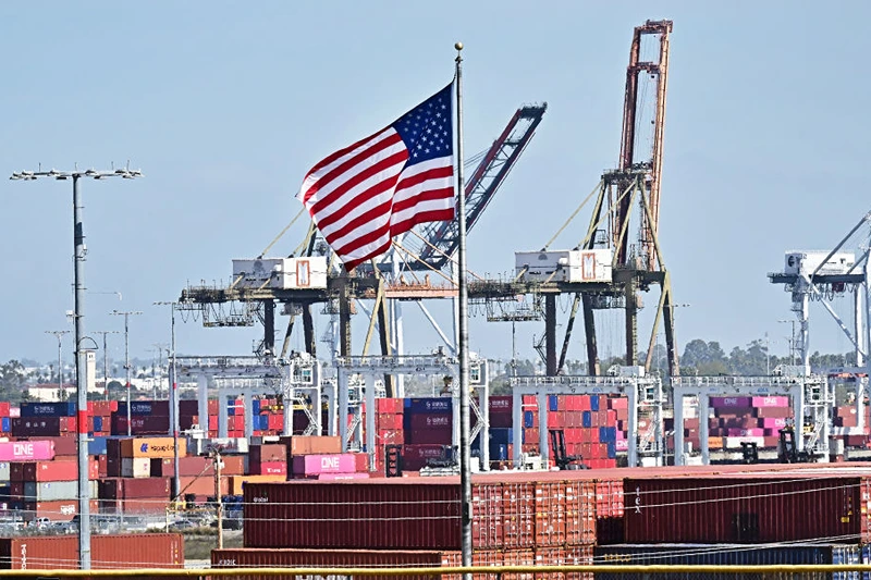 Shipping containers are stacked high at the Port of Long Beach on March 4, 2025 in Long Beach, California, as US President Donald Trump's tariffs on Canada and Mexico take effect. US President Donald Trump could announce a compromise tariff arrangement with Canada and Mexico on March 5, his commerce secretary said in an interview, shortly after sweeping 25-percent levies went into effect.
