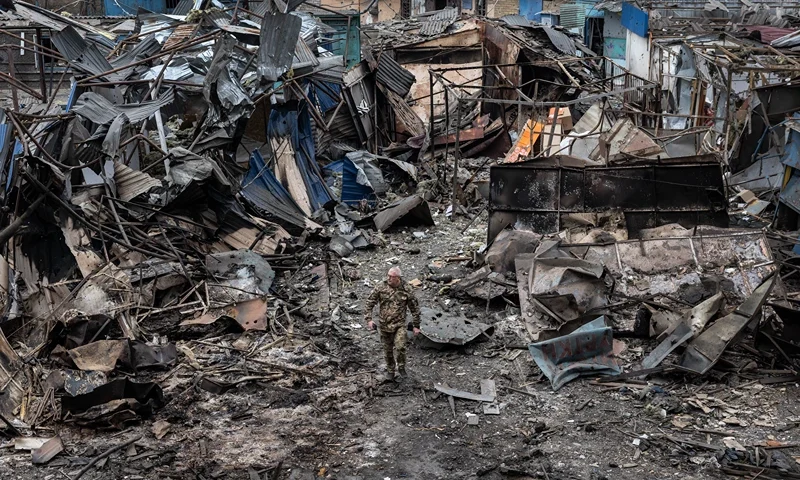 DOBROPILLIA, UKRAINE - MARCH 10: Ukrainian military walk through the destruction after a large scale Russian attack on a residential complex on March 7th that killed 11 people and injured 47 on March 10, 2025 in Dobropillia, Ukraine. U.S. President Donald Trump's recent decision to pause intelligence sharing with Kyiv has sparked concerns in Ukraine that Russian missile strikes could now strike cities without prior warning. (Photo by Paula Bronstein / Getty Images)