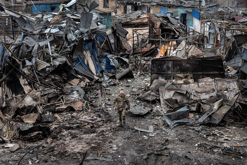 DOBROPILLIA, UKRAINE - MARCH 10: Ukrainian military walk through the destruction after a large scale Russian attack on a residential complex on March 7th that killed 11 people and injured 47 on March 10, 2025 in Dobropillia, Ukraine. U.S. President Donald Trump's recent decision to pause intelligence sharing with Kyiv has sparked concerns in Ukraine that Russian missile strikes could now strike cities without prior warning. (Photo by Paula Bronstein / Getty Images)