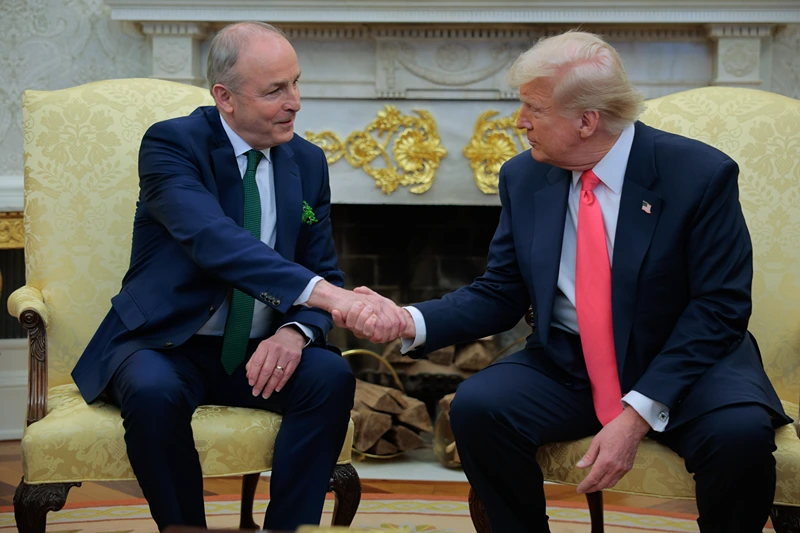 Irish Taoiseach Micheal Martin and U.S. President Donald Trump shake hands as they speak to journalists ahead of meetings in the Oval Office at the White House on March 12, 2025 in Washington, DC. Martin is visiting the United States for the Irish leader's annual St. Patrick's Day visit where he met with U.S. President Donald Trump ahead of a St. Patrick's Day luncheon with Congressional leaders. (Photo by Chip Somodevilla/Getty Images)