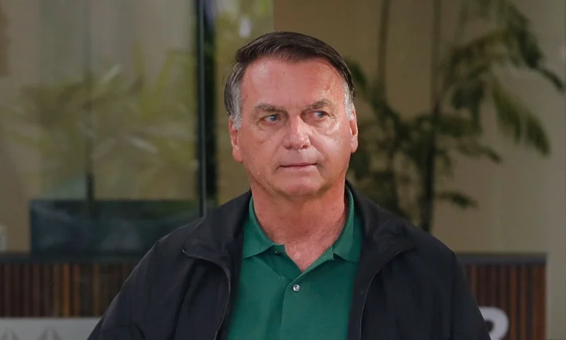 Former Brazil's President (2019-2022) Jair Bolsonaro arrives at Brasilia airport on March 25, 2025. Brazil's Supreme Court will weigh on March 25, 2025, whether to put far-right former president Jair Bolsonaro on trial for allegedly masterminding an attempted coup after losing elections in 2022. If convicted, the 70-year-old risks a prison sentence of about 40 years. (Photo by Sergio Lima / AFP) (Photo by SERGIO LIMA/AFP via Getty Images)