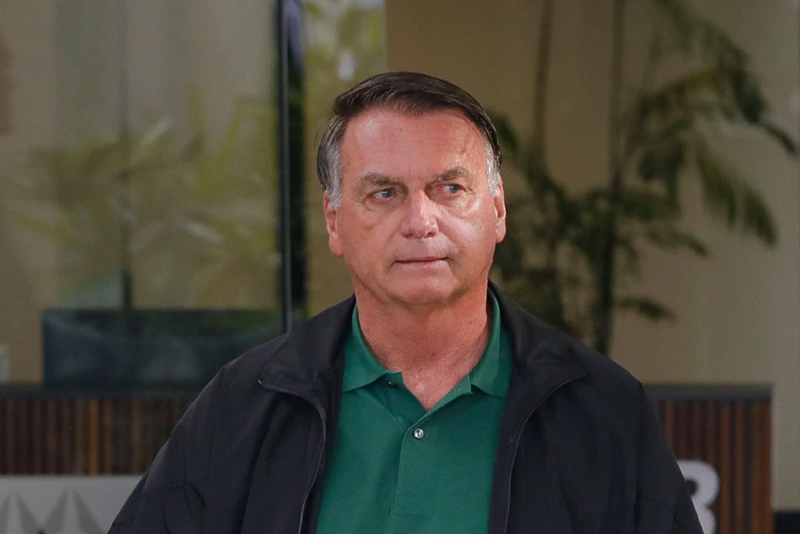 Former Brazil's President (2019-2022) Jair Bolsonaro arrives at Brasilia airport on March 25, 2025. Brazil's Supreme Court will weigh on March 25, 2025, whether to put far-right former president Jair Bolsonaro on trial for allegedly masterminding an attempted coup after losing elections in 2022. If convicted, the 70-year-old risks a prison sentence of about 40 years. (Photo by Sergio Lima / AFP) (Photo by SERGIO LIMA/AFP via Getty Images)