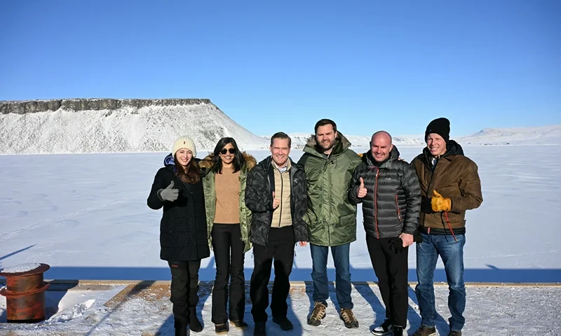 PITUFFIK, GREENLAND - MARCH 28: US Vice President JD Vance (C) poses with Second Lady Usha Vance (2nd L), National Security Advisor Mike Waltz (3rd L), his wife , former homeland security advisor, Julia Nesheiwat (L) and Secretary of Energy Chris Wright (R) as they tour the US military's Pituffik Space Base on March 28, 2025 in Pituffik, Greenland. The itinerary for the visit was scaled back after a plan for a more extensive trip drew criticism from officials in Greenland and Denmark, which controls foreign and defence policy of the semiautonomous territory. (Photo by Jim Watson - Pool / Getty Images)