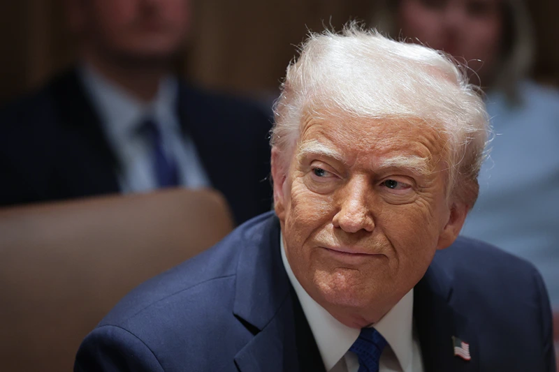 WASHINGTON, DC - MARCH 25: U.S. President Donald Trump listens to a reporter's question during an Ambassador Meeting in the Cabinet Room of the White House on March 25, 2025 in Washington, DC. During the meeting, Trump answered questions from reporters on the news that Jeffrey Goldberg, the editor-in-chief of The Atlantic magazine, was accidentally added to a Signal group chat of top administration officials, where highly sensitive national security information was discussed. (Photo by Win McNamee/Getty Images)