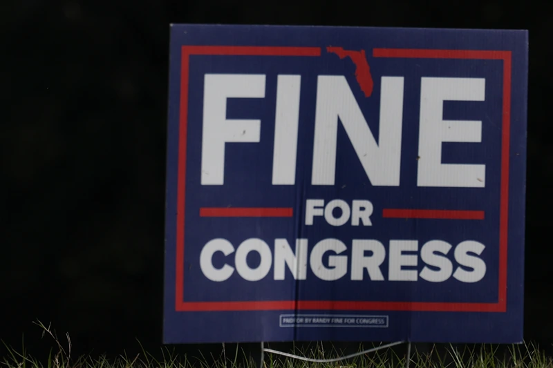 Campaign signs sit on the side of the road supporting Democratic nominee Josh Weil outside of his campaign event at the Silver Springs Shores Community Center on March 26, 2025 in Ocala, Florida. Polls show that Mr. Weil is within the margin of error in defeating Republican Randy Fine to flip National Security Advisor Mike Waltz's old seat in the U.S. House of Representatives. The race for the 6th district is one of two Florida Congressional special elections set for April 1st. (Photo by Joe Raedle/Getty Images)