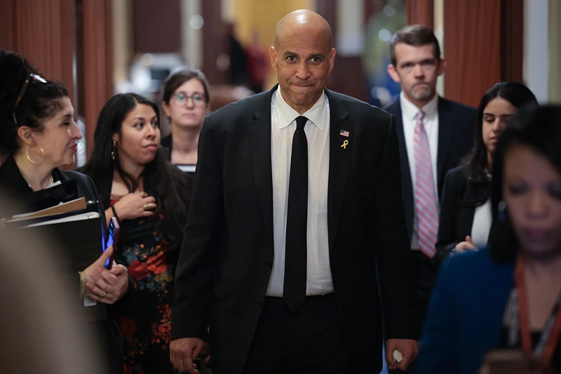 WASHINGTON, DC - APRIL 01: U.S. Sen. Cory Booker (D-NJ) walks toward reporters after delivering a record setting floor speech for the U.S. Senate at the U.S. Capitol on April 01, 2025 in Washington, DC. Booker spoke for over 25 hours, protesting President Trump’s agenda on the Senate floor, breaking a record set by Sen. Strom Thurmond’s 24 hour, 18 minute filibuster against the Civil Rights Act in 1957. (Photo by Win McNamee/Getty Images)