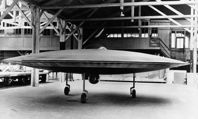 A 3/5 scale model of a proposed VTOL 'flying saucer' aircraft, the Couzinet Aerodyne RC-360, on display at a workshop on the Ile de la Jatte in Levallois-Perret, Paris, 1955. Designed by French aeronautical engineer Rene Couzinet (1904 - 1956), the Aerodyne was to feature two contra-rotating crowns of 96 small wings rotating around a motionless cockpit. These were to be powered by six 180 HP Lycoming engines in three pairs. Horizontal propulsion was to be provided by the jet engine, which can be seen mounted under the cockpit. The aircraft was refused government backing, however, and never reached the prototype stage. (Photo by Keystone/Hulton Archive/Getty Images)