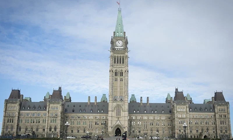 The Canadian Parliament is seen on October 23, 2014, in Ottawa, the day after multiple shootings in the capital city and Parliament buildings left a soldier dead and others wounded. A gunman whose name was on a terror watch list killed a soldier and attempted to storm Canada's parliament October 22 before the assembly's sergeant-at-arms shot him dead. The attack -- the second this week targeting Canadian military personnel -- came as Canadian jets were to join the US-led bombing campaign against Islamist militants in Iraq. AFP PHOTO/PETER MCCABE (Photo credit should read Peter McCabe/AFP via Getty Images)