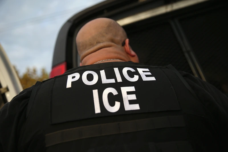 LOS ANGELES, CA - OCTOBER 14: U.S. Immigration and Customs Enforcement (ICE), agents detain an immigrant on October 14, 2015 in Los Angeles, California. ICE agents said the immigrant, a legal resident with a Green Card, was a convicted criminal and member of the Alabama Street Gang in the Canoga Park area. ICE builds deportation cases against thousands of immigrants living in the United States. Green Card holders are also vulnerable to deportation if convicted of certain crimes. The number of ICE detentions and deportations from California has dropped since the state passed the Trust Act in October 2013, which set limits on California state law enforcement cooperation with federal immigration authorities. (Photo by John Moore/Getty Images)