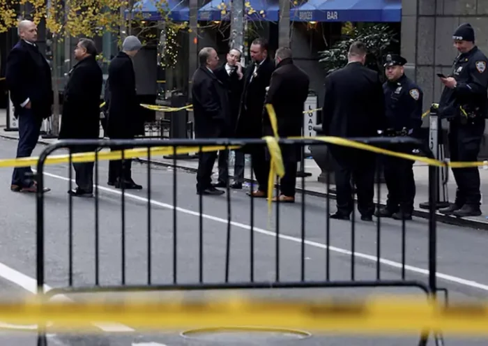 Law enforcement officers stand near the scene where the CEO of UnitedHealthcare Brian Thompson was reportedly shot and killed in Midtown Manhattan, in New York City, US, December 4, 2024.REUTERS/Shannon Stapleton/File Photo