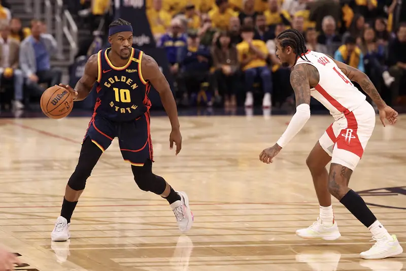 Golden State Warriors forward Jimmy Butler III (10) controls the ball against Houston Rockets guard Jalen Green (4) during the second quarter of game four of the 2025 NBA Playoffs first round at Chase Center. Mandatory Credit: Kelley L Cox-Imagn Images