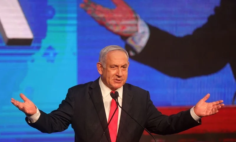 Israeli Prime Minister Benjamin Netanyahu, leader of the Likud party, addresses supporters at the party campaign headquarters in Jerusalem early on March 24, 2021, after the end of voting in the fourth national election in two years. (Photo by EMMANUEL DUNAND / AFP) (Photo by EMMANUEL DUNAND/AFP via Getty Images)