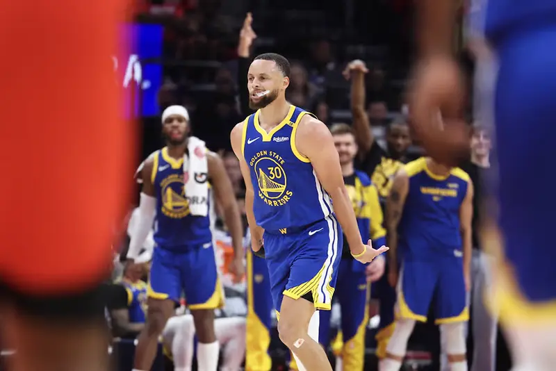 Golden State Warriors guard Stephen Curry (30) reacts after making a basket during the second quarter against the Houston Rockets at Toyota Center. Mandatory Credit: Troy Taormina-Imagn Images