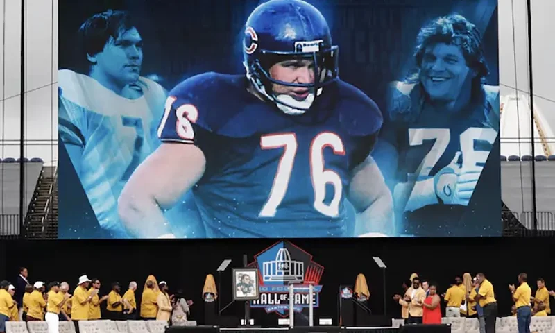 A video is played of Class of 2024 member Steve Mc Michael during his induction into the Pro Football Hall of Fame at the enshrinement ceremony at Tom Benson Hall of Fame Stadium. McMichael was unable to attend in person. Mandatory Credit: Charles LeClaire-USA TODAY Sports/File Photo