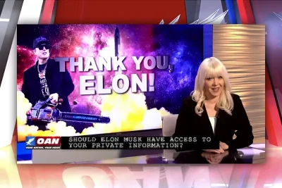 The host sitting at the news desk.