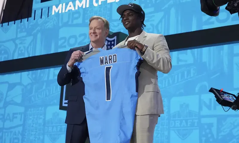 NFL commissioner Roger Goodell stands with Miami Hurricanes quarterback Cameron Ward after he is selected by the Tennessee Titans as the number one pick in the first round of the 2025 NFL Draft at Lambeau Field. Mandatory Credit: Kirby Lee-Imagn Images