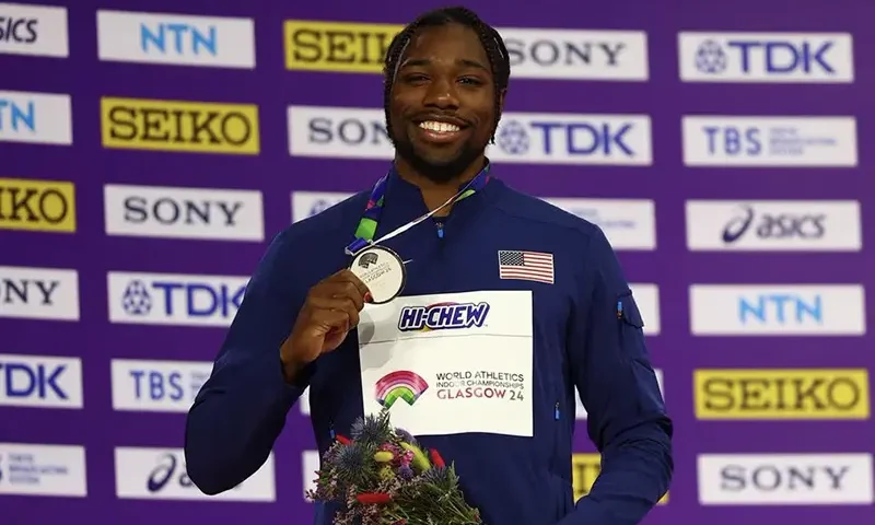 Silver medallist Noah Lyles of the U.S. poses on the podium during the medal ceremony for the men's 60m REUTERS/Hannah Mckay/File Photo