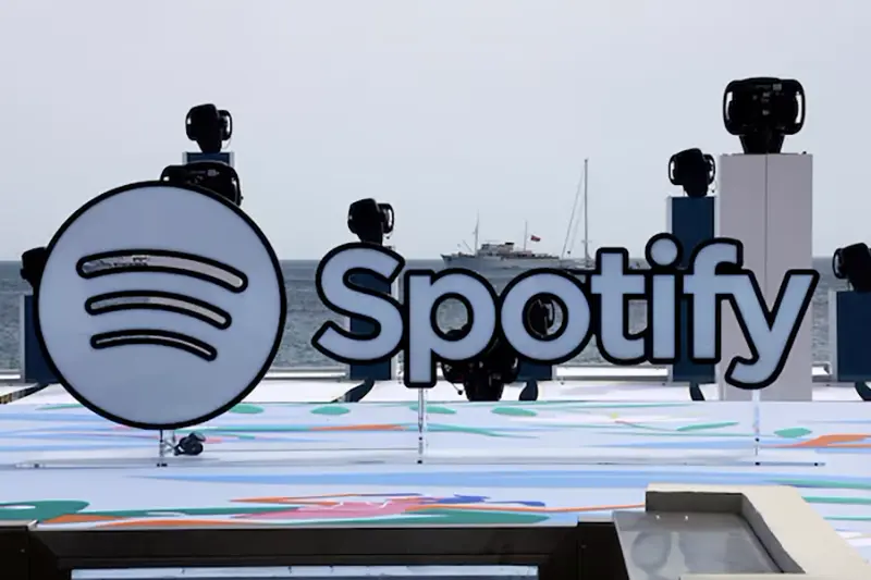 A logo of Spotify is seen on a beach during the Cannes Lions International Festival of Creativity in Cannes, France, June 20, 2023. REUTERS/Eric Gaillard/File Photo