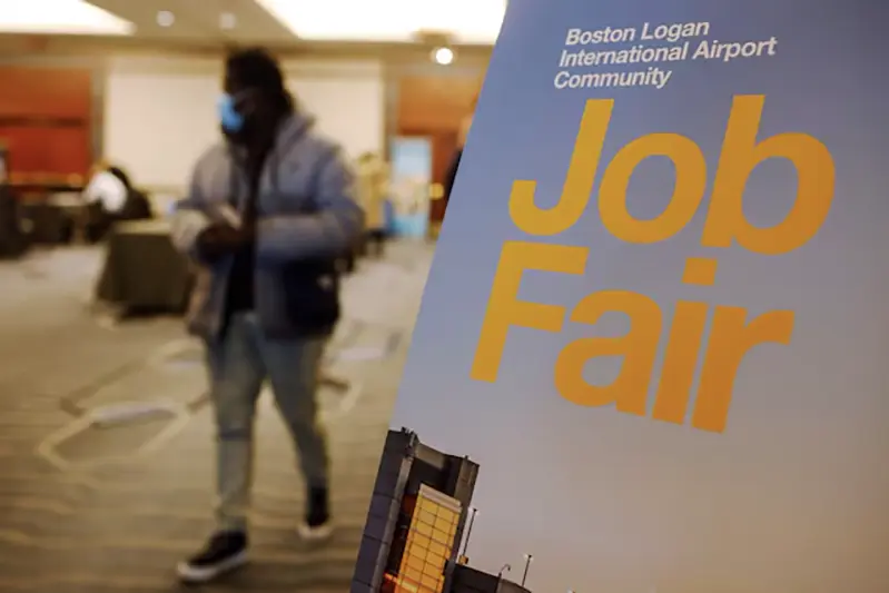 A job seeker leaves the job fair for airport related employment at Logan International Airport in Boston, Massachusetts, U.S., December 7, 2021. REUTERS/Brian Snyder/File Photo
