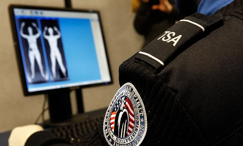 ARLINGTON, VA - DECEMBER 30: Transportation Security Administration Security Officer Nyamsi Tchapleu looks at images created by a "backscatter" scanner during a demonstration at the Transportation Security Administration's Systems Integration Facility at Ronald Reagan National Airport December 30, 2009 in Arlington, Virginia. Backscatter technology uses low level x-rays to create a two-sided image. The scan can detect hidden metallic and nonmetallic objects such as weapons and explosives without physical contact. The TSA will roll out 150 backscatter scanners in 2010 and has budgeted for 300 additional imaging units. (Photo by Chip Somodevilla/Getty Images)