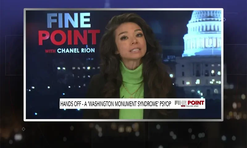 Video still of the host of Fine Point at the desk of their talk show on One America News Network.