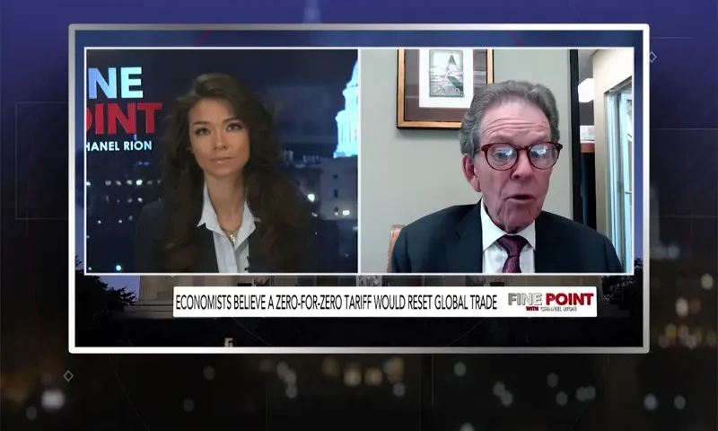 Video still from Fine Point on One America News Network showing a split screen of the host on the left side, and on the right side is the guest, Dr. Arthur Laffer.
