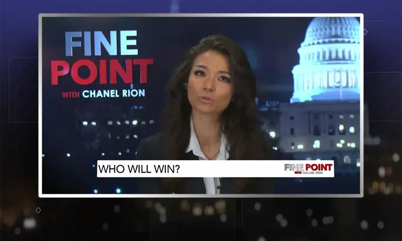 Video still of the host of Fine Point at the desk of their talk show on One America News Network.