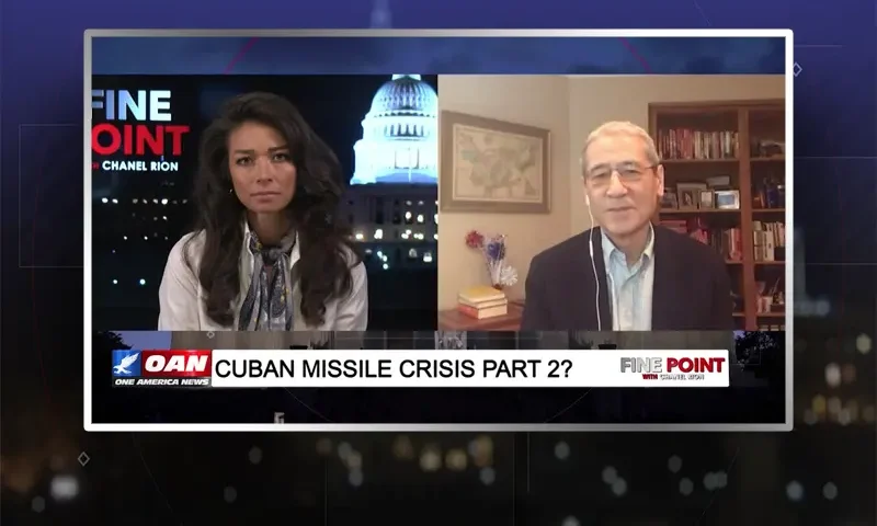 Video still from Fine Point on One America News Network showing a split screen of the host on the left side, and on the right side is the guest, Gordon Chang.