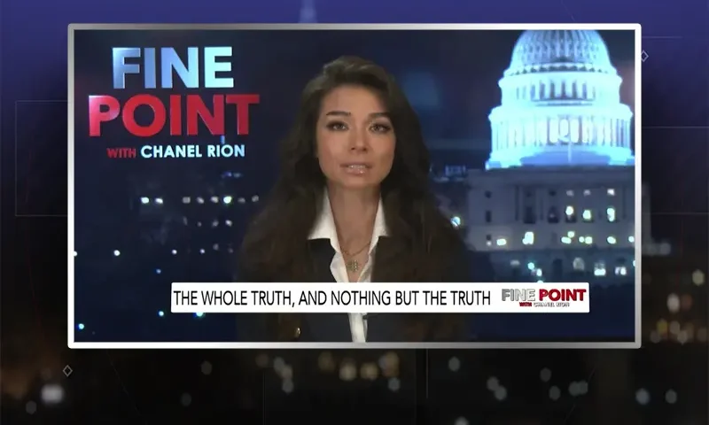 Video still of the host of Fine Point at the desk of their talk show on One America News Network.