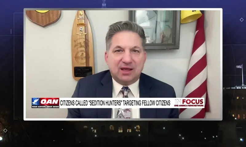 Video still from In Focus on One America News Network during an interview with the guest, John Guandolo.
