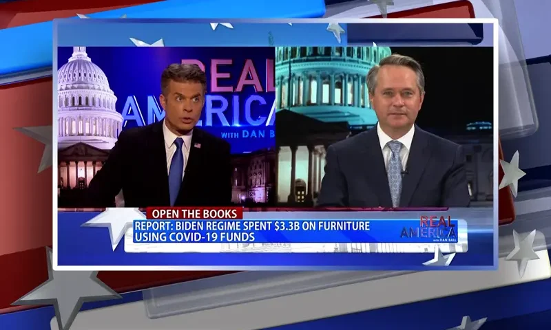 Video still from Real America on One America News Network showing a split screen of the host on the left side, and on the right side is the guest, John Hart.