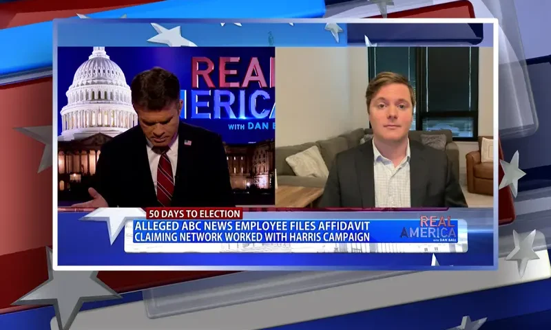 Video still from Real America on One America News Network showing a split screen of the host on the left side, and on the right side is the guest, Bill D'Agostino.