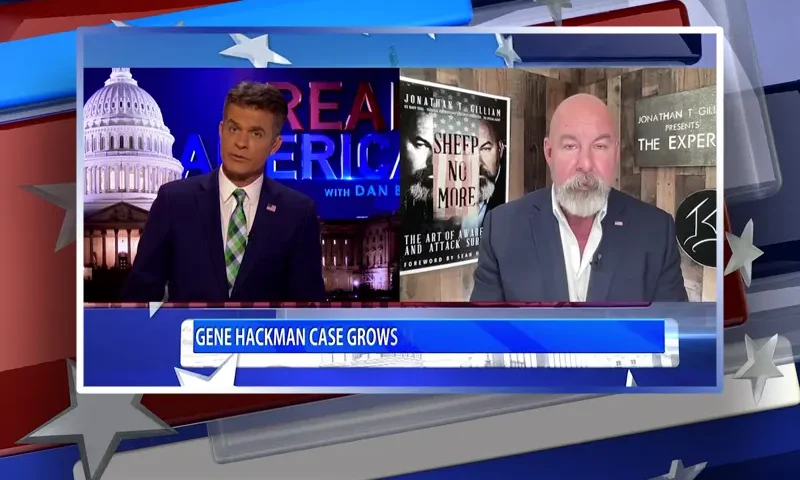Video still from Real America on One America News Network showing a split screen of the host on the left side, and on the right side is the guest, Jonathan Gilliam.