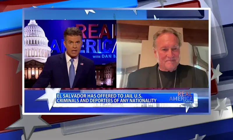 Video still from Real America on One America News Network showing a split screen of the host on the left side, and on the right side is the guest, Joseph Travers.