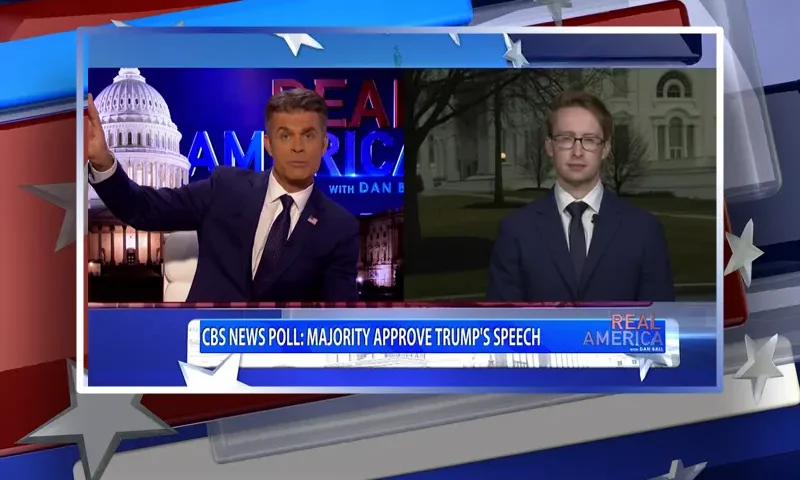 Video still from Real America on One America News Network showing a split screen of the host on the left side, and on the right side is the guest, Daniel Baldwin.