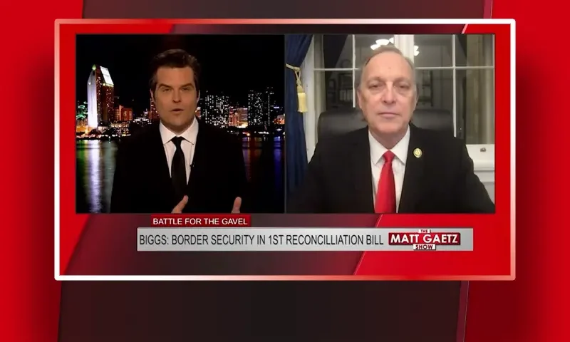 Video still from The Matt Gaetz Show on One America News Network showing a split screen of the host on the left side, and on the right side is the guest, Rep. Andy Biggs.