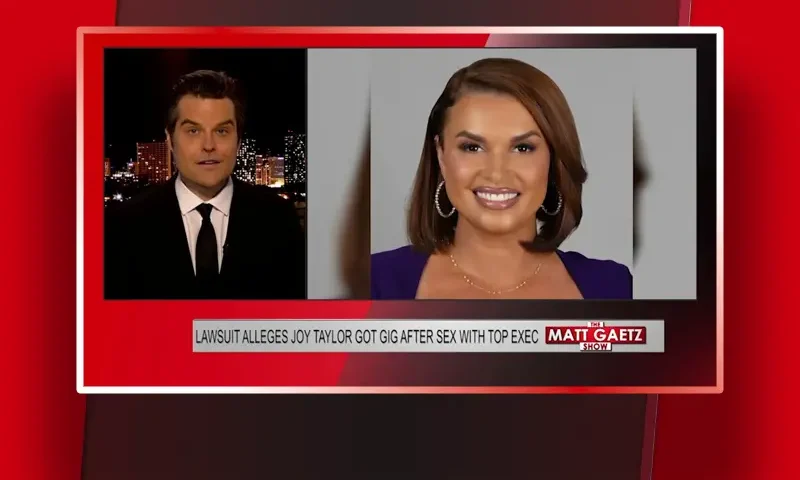 Video still of the host of The Matt Gaetz Show at the desk of their talk show on One America News Network.
